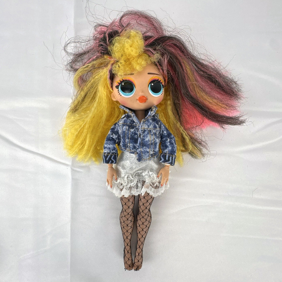 MGA L.O.L. Surprise! O.M.G. Remix Pop B.B. fashion doll wearing acid-wash denim jacket and lace skirt