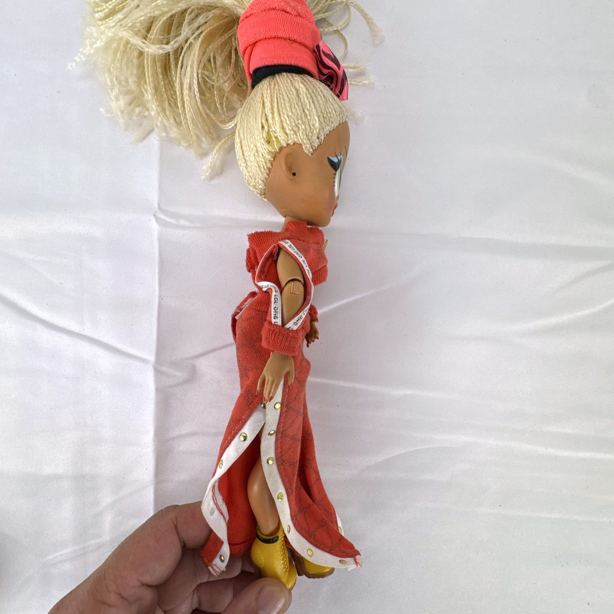 L.O.L. Surprise! O.M.G. Series 1 Swag fashion doll in red tracksuit with blonde micro braids