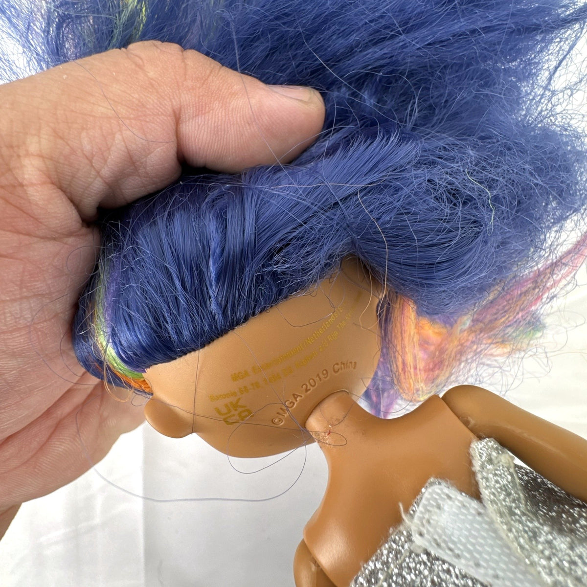 MGA L.O.L. Surprise OMG Queens Prism fashion doll with blue rainbow hair and metallic outfit
