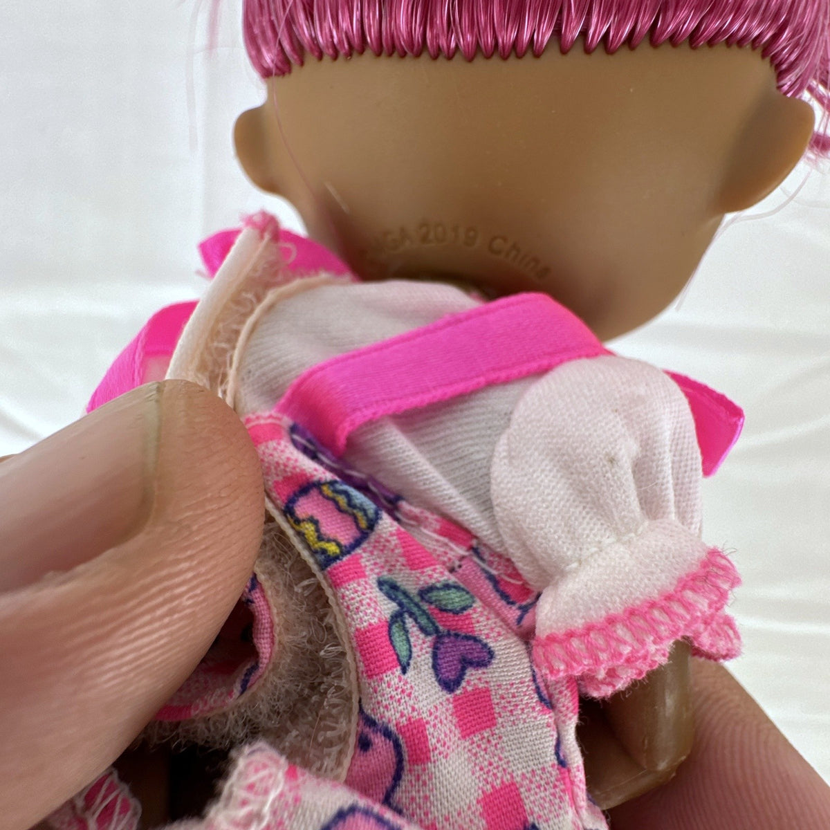 MGA LOL Surprise OMG Spirit Queen doll with two-tone pink and white hair, spiderweb makeup, and purple boots