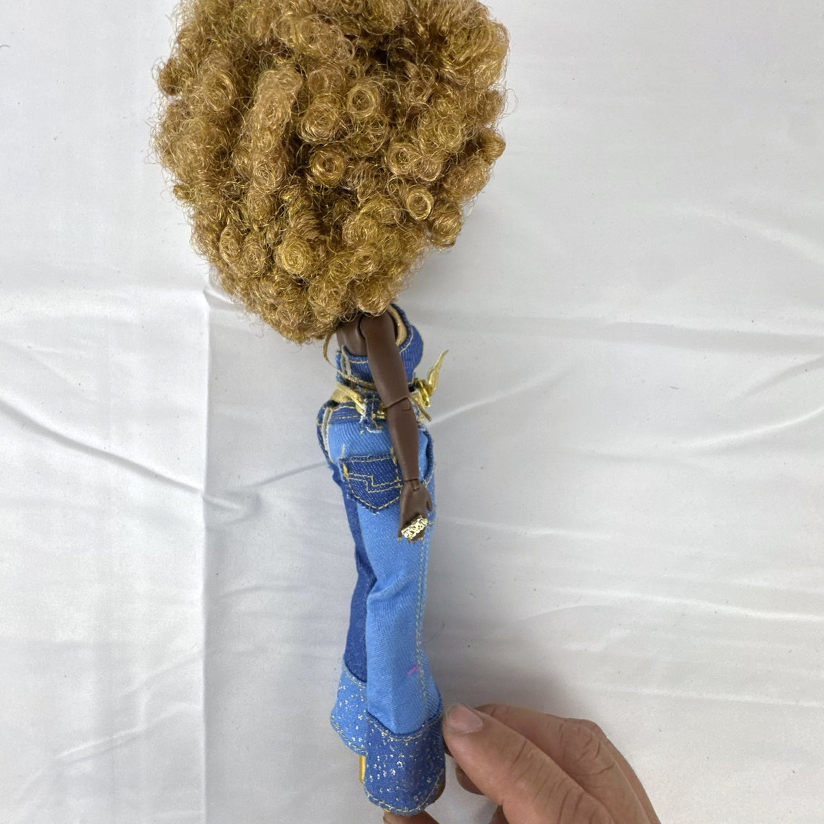 MGA L.O.L. Surprise! O.M.G. Series 3 Da Boss 10-inch doll in patchwork denim jumpsuit with blonde afro