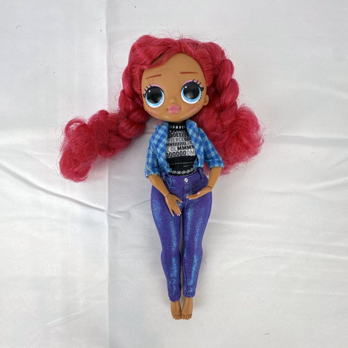 MGA L.O.L. Surprise! O.M.G. Downtown B.B. 10-inch doll with pink curly hair in blue plaid jacket and purple pants
