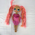 MGA L.O.L. Surprise O.M.G. Lights Dazzle 10-inch fashion doll with braided pink tinsel hair in a metallic sequin dress