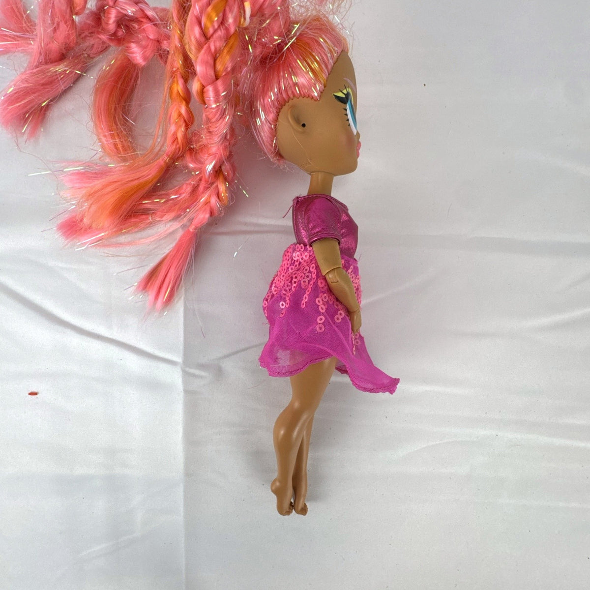 MGA L.O.L. Surprise O.M.G. Lights Dazzle 10-inch fashion doll with braided pink tinsel hair in a metallic sequin dress