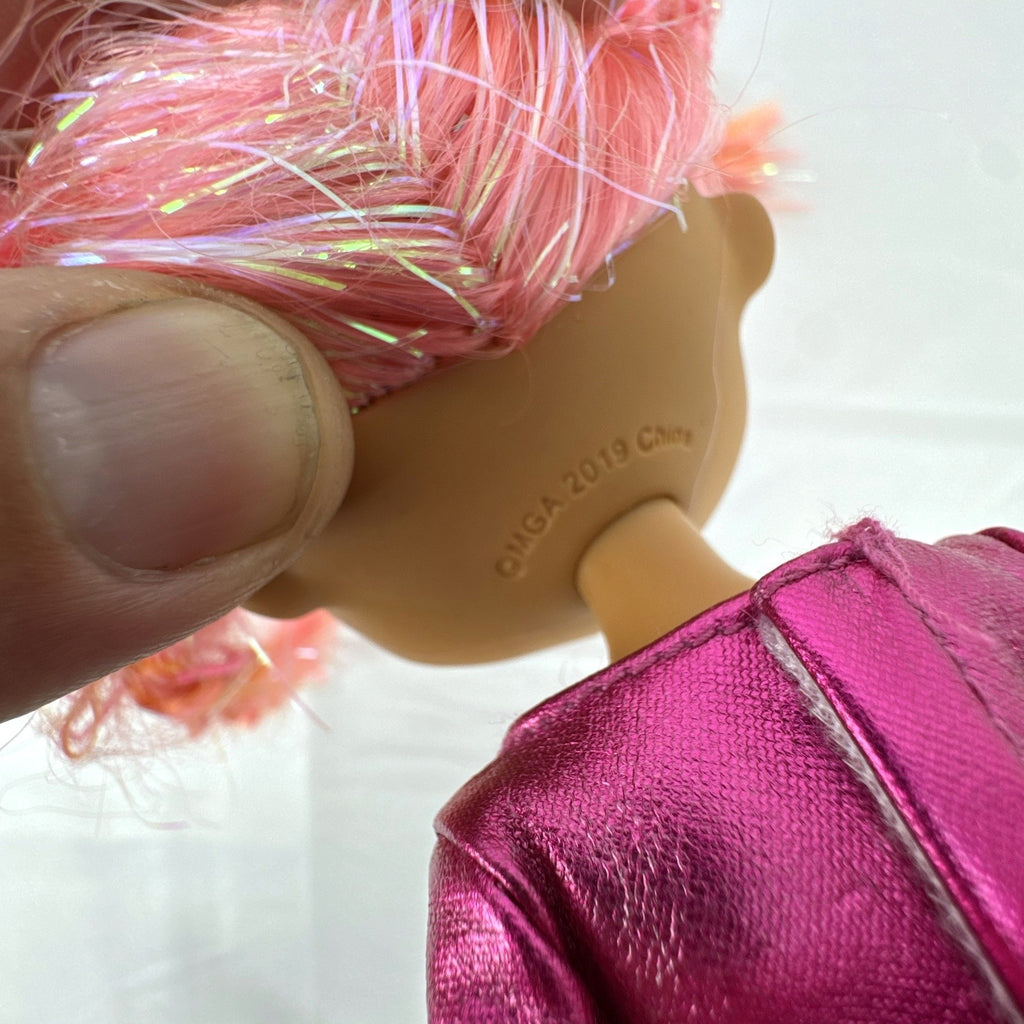 MGA L.O.L. Surprise O.M.G. Lights Dazzle 10-inch fashion doll with braided pink tinsel hair in a metallic sequin dress