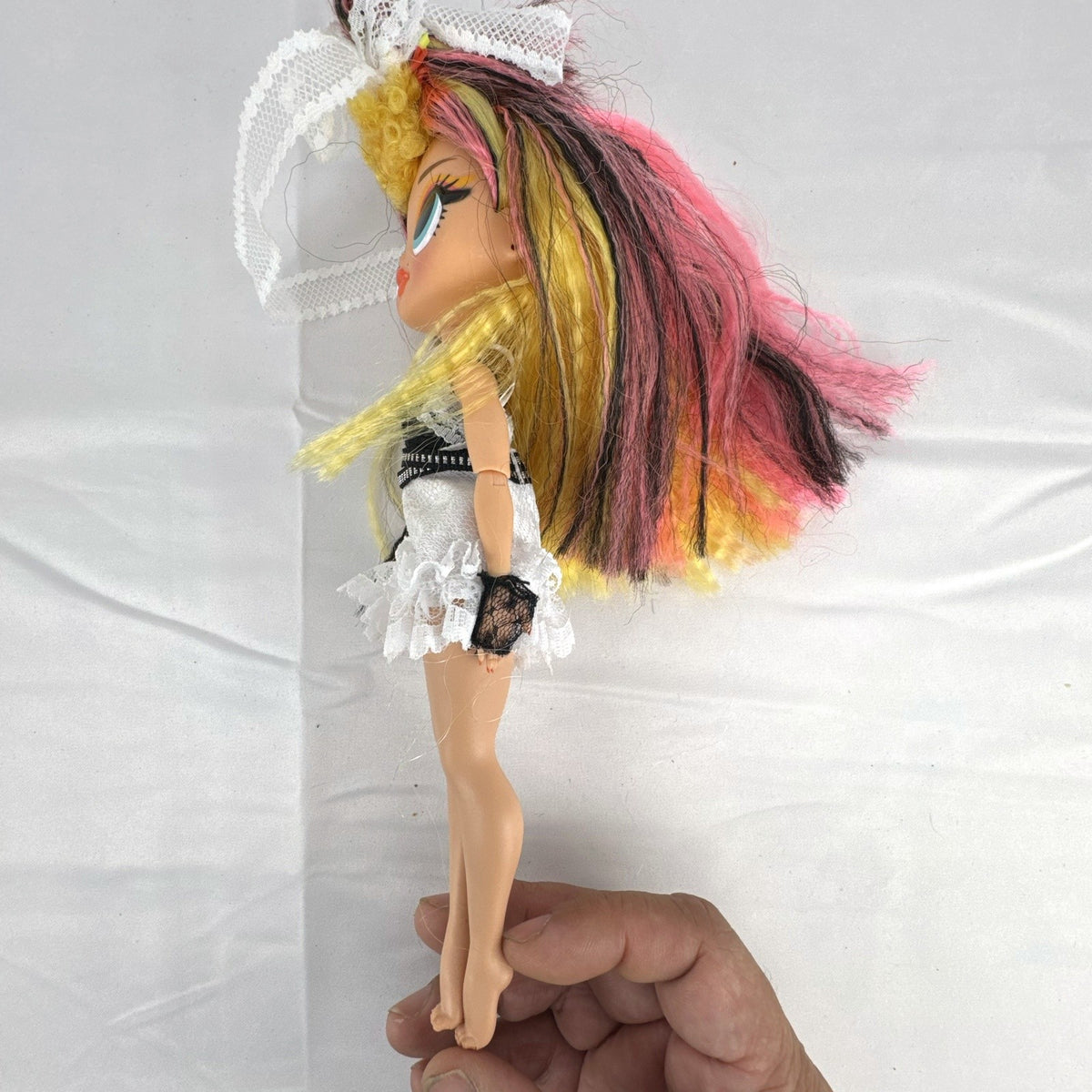 MGA L.O.L. Surprise! O.M.G. Remix Pop B.B. 10-inch fashion doll in white lace dress with tricolor hair