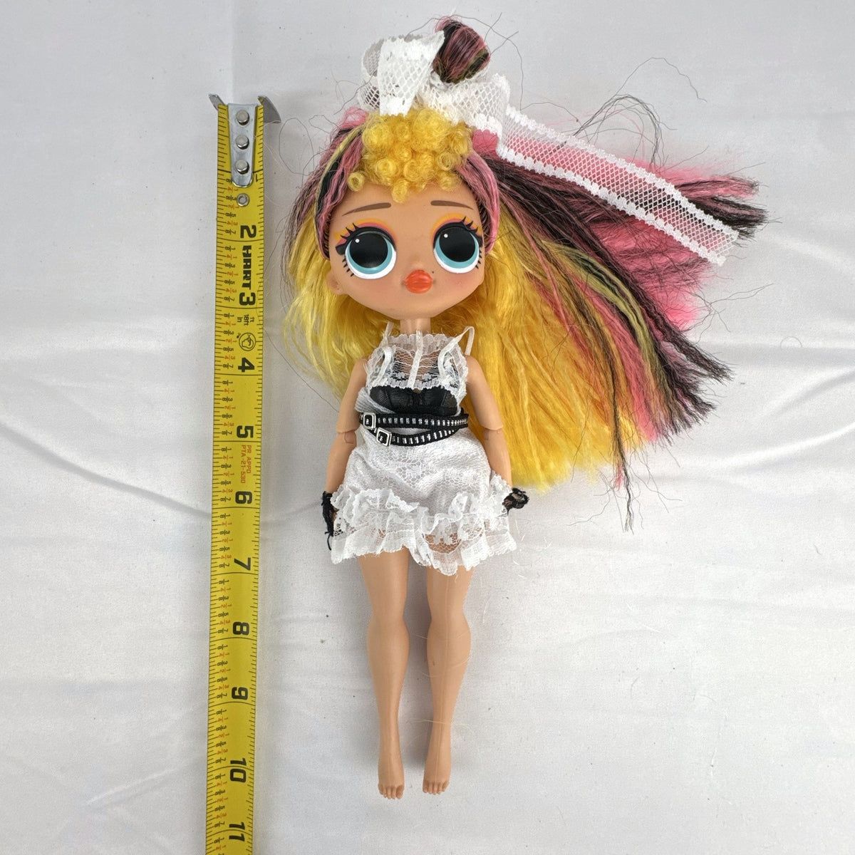MGA L.O.L. Surprise! O.M.G. Remix Pop B.B. 10-inch fashion doll in white lace dress with tricolor hair