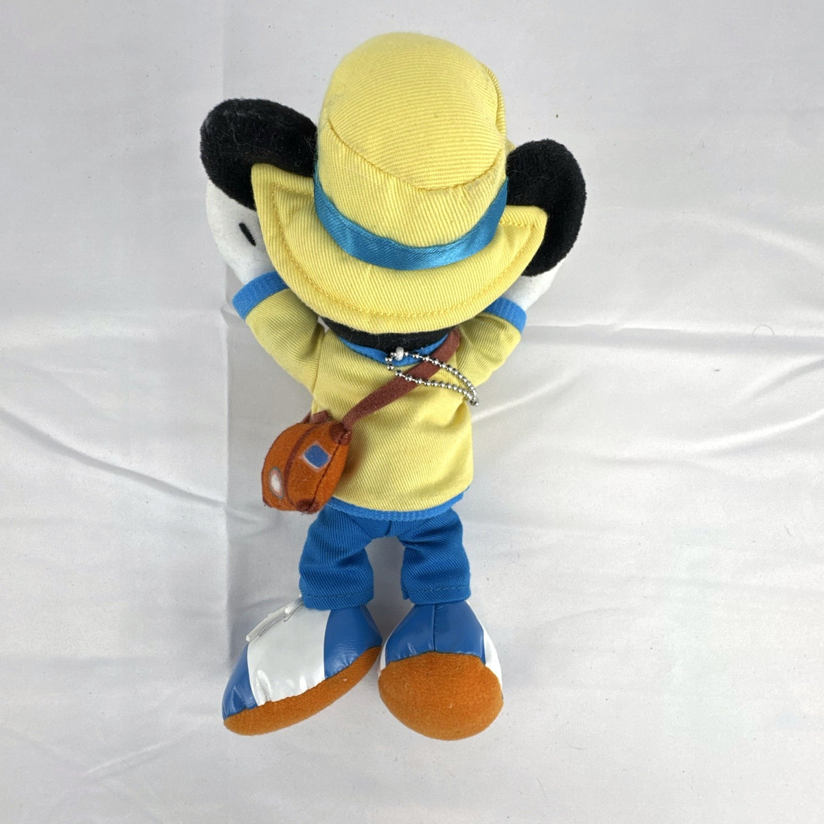 Tokyo Disney Resort Vacation Packages Mickey Mouse 9.5 inch plush keychain with hand clips in yellow travel outfit