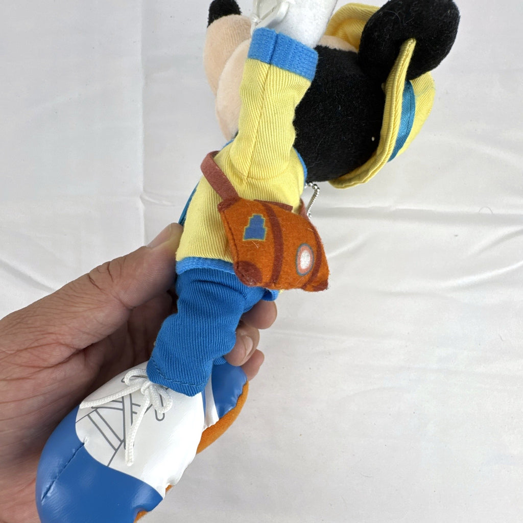 Tokyo Disney Resort Vacation Packages Mickey Mouse 9.5 inch plush keychain with hand clips in yellow travel outfit