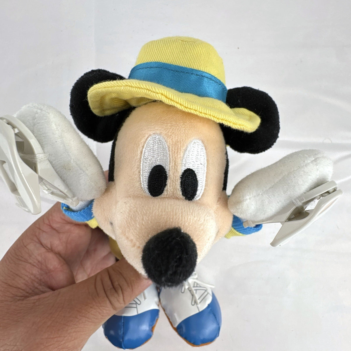 Tokyo Disney Resort Vacation Packages Mickey Mouse 9.5 inch plush keychain with hand clips in yellow travel outfit