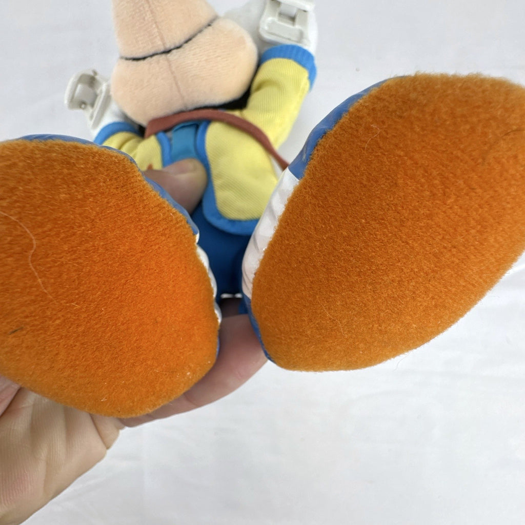Tokyo Disney Resort Vacation Packages Mickey Mouse 9.5 inch plush keychain with hand clips in yellow travel outfit