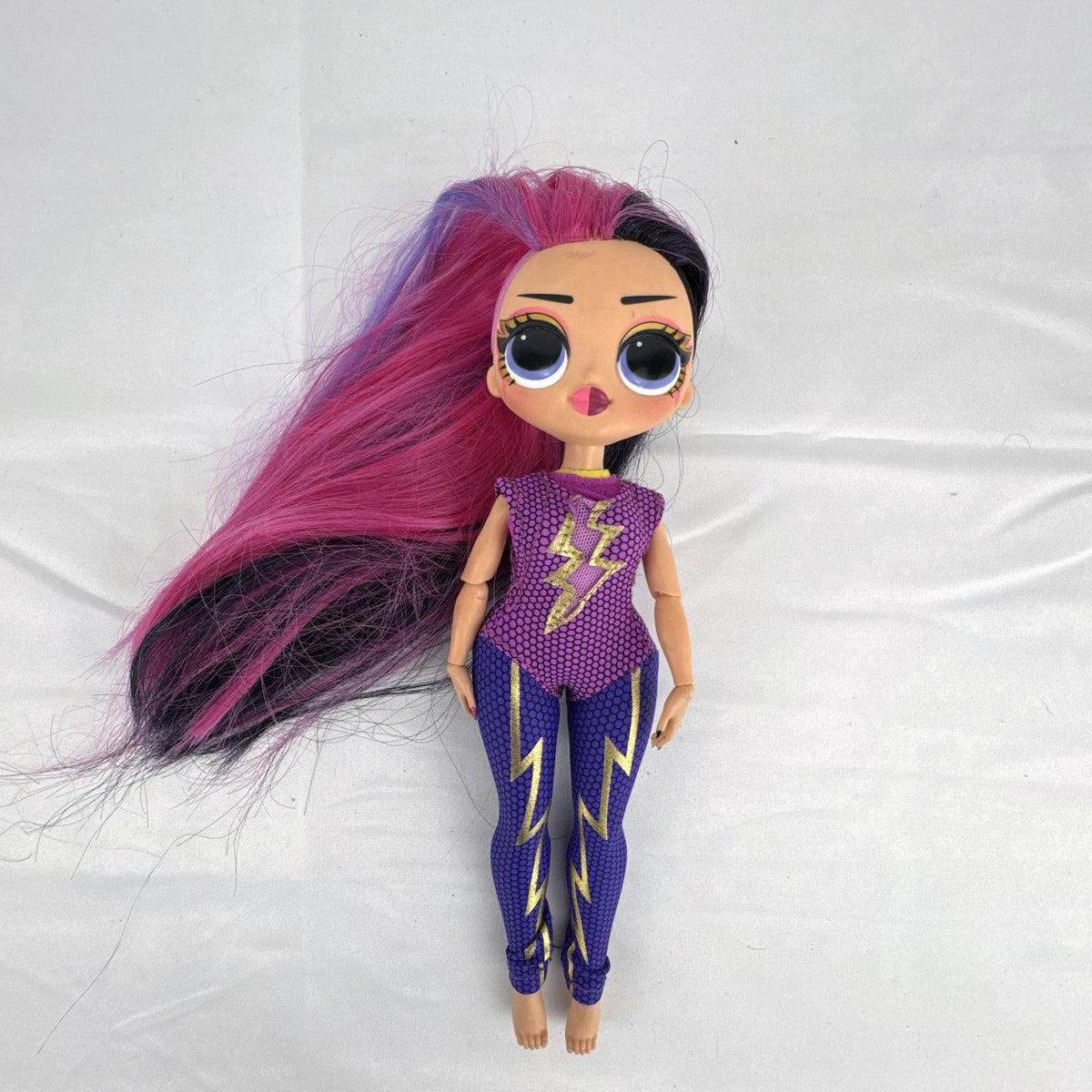 MGA Entertainment LOL Surprise OMG Ms. Direct 10-inch fashion doll wearing purple lightning bolt bodysuit