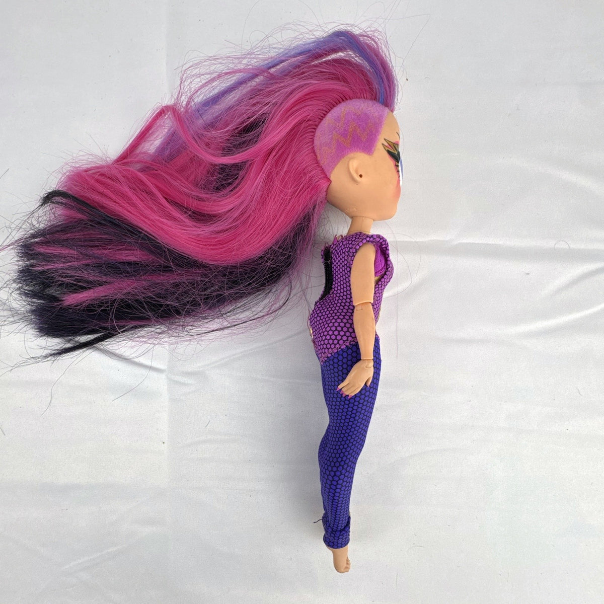 MGA Entertainment LOL Surprise OMG Ms. Direct 10-inch fashion doll wearing purple lightning bolt bodysuit