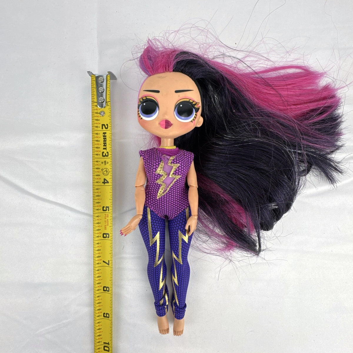 MGA Entertainment LOL Surprise OMG Ms. Direct 10-inch fashion doll wearing purple lightning bolt bodysuit