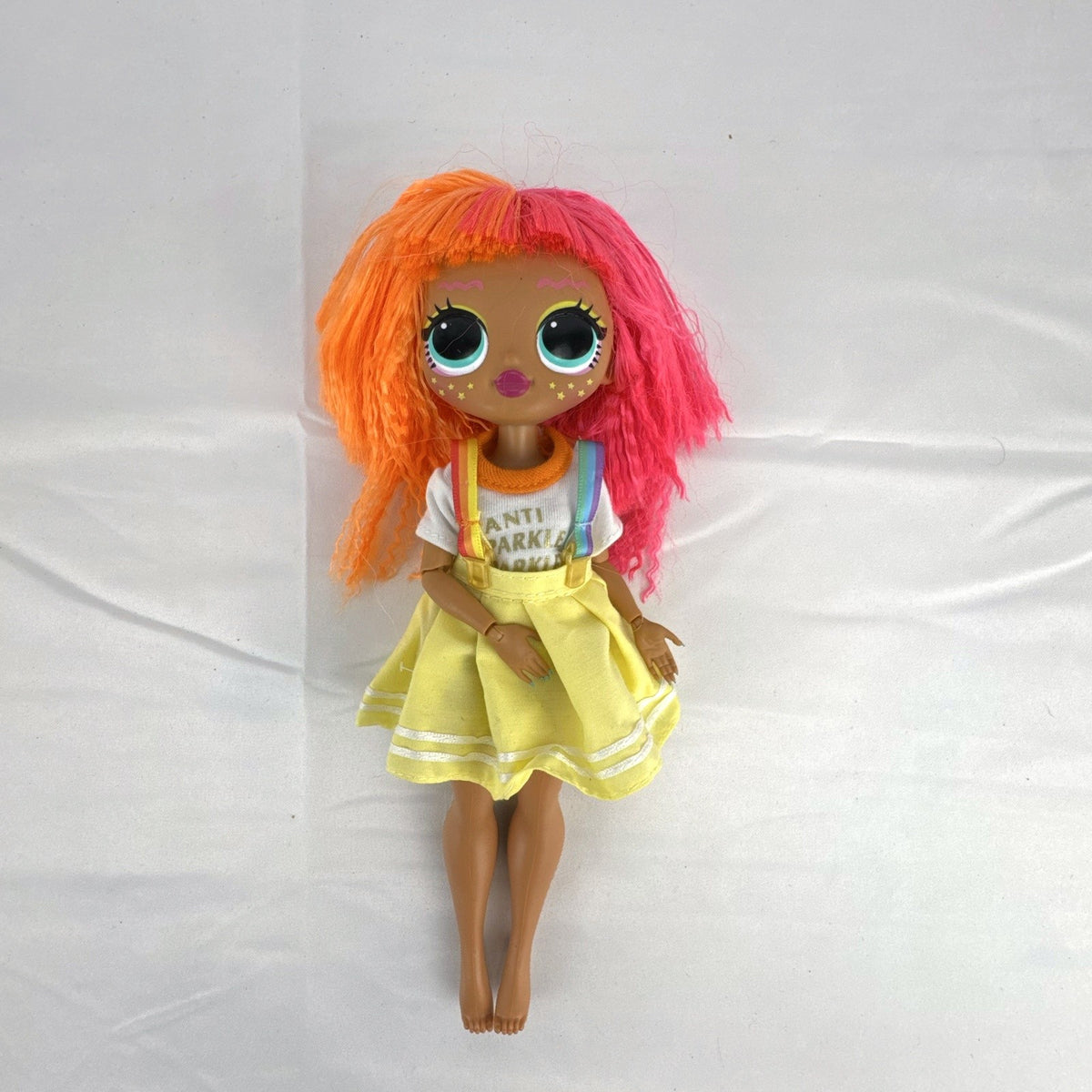 MGA LOL Surprise OMG Neonlicious fashion doll with split neon orange and pink hair and pleated skirt