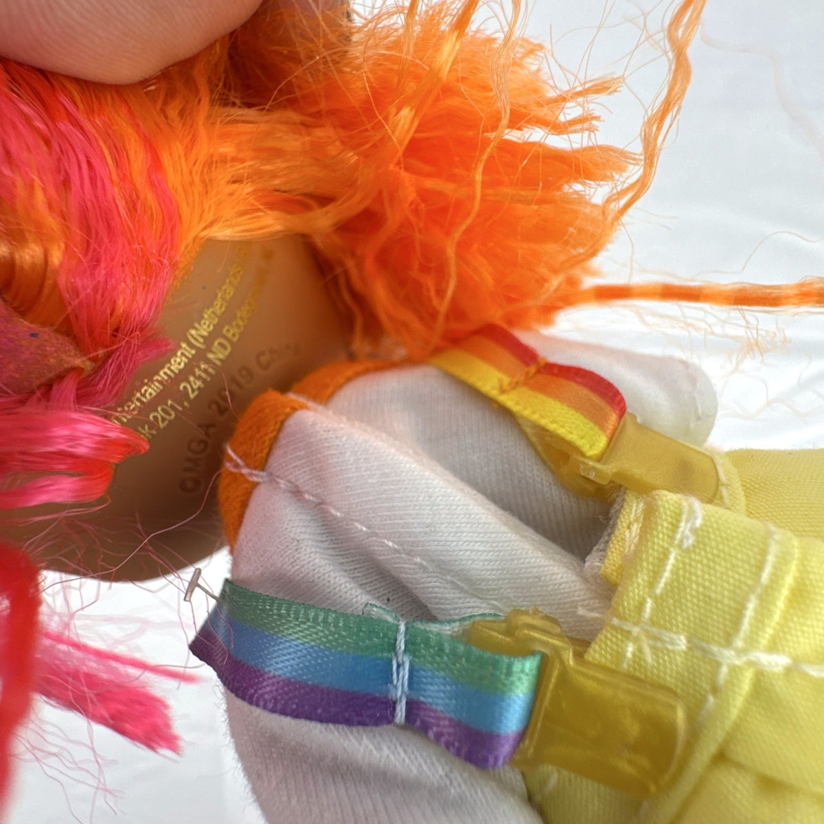 MGA LOL Surprise OMG Neonlicious fashion doll with split neon orange and pink hair and pleated skirt