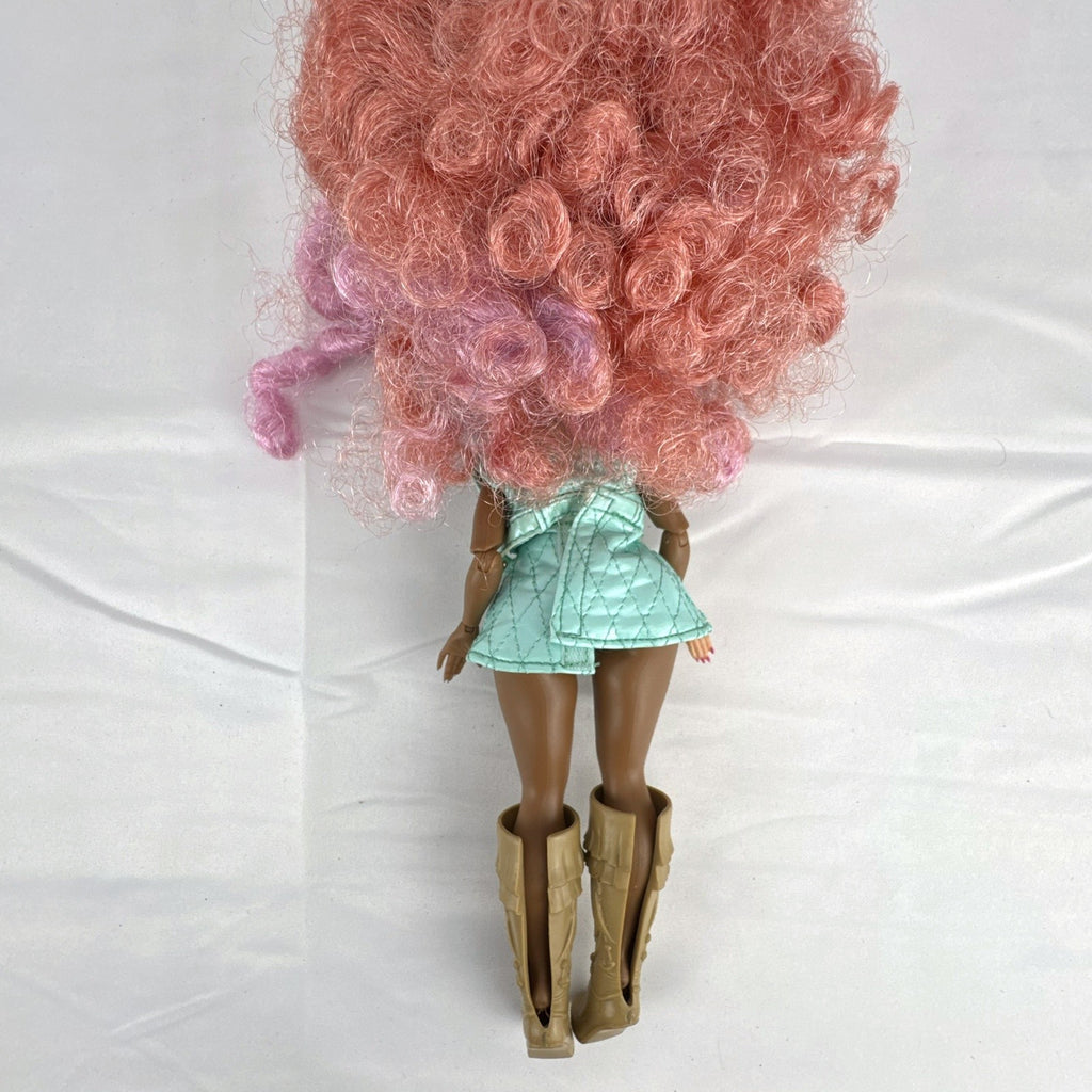 MGA L.O.L. Surprise! O.M.G. Roller Chick fashion doll with voluminous pink curls wearing a mint outfit and tall boots.