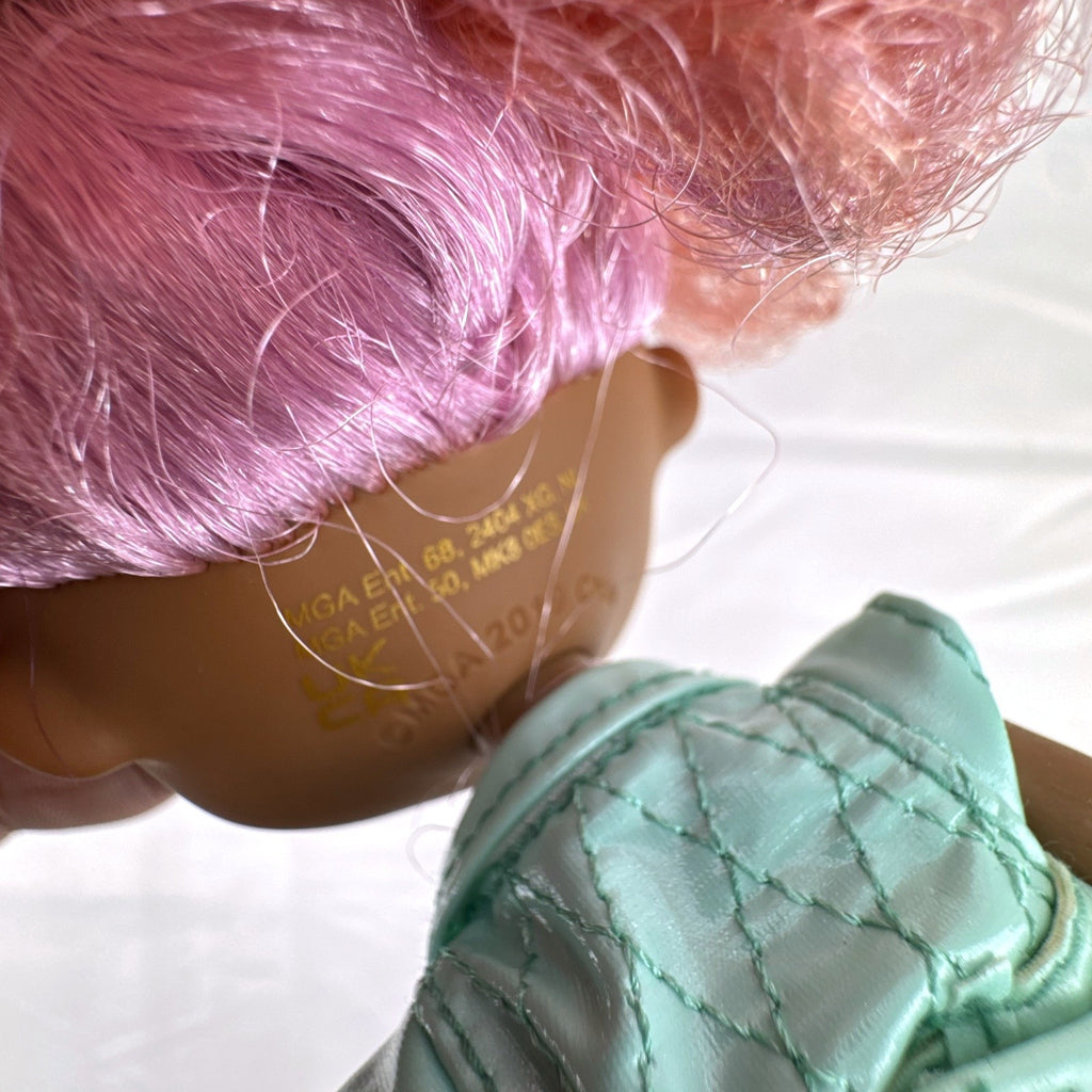 MGA L.O.L. Surprise! O.M.G. Roller Chick fashion doll with voluminous pink curls wearing a mint outfit and tall boots.