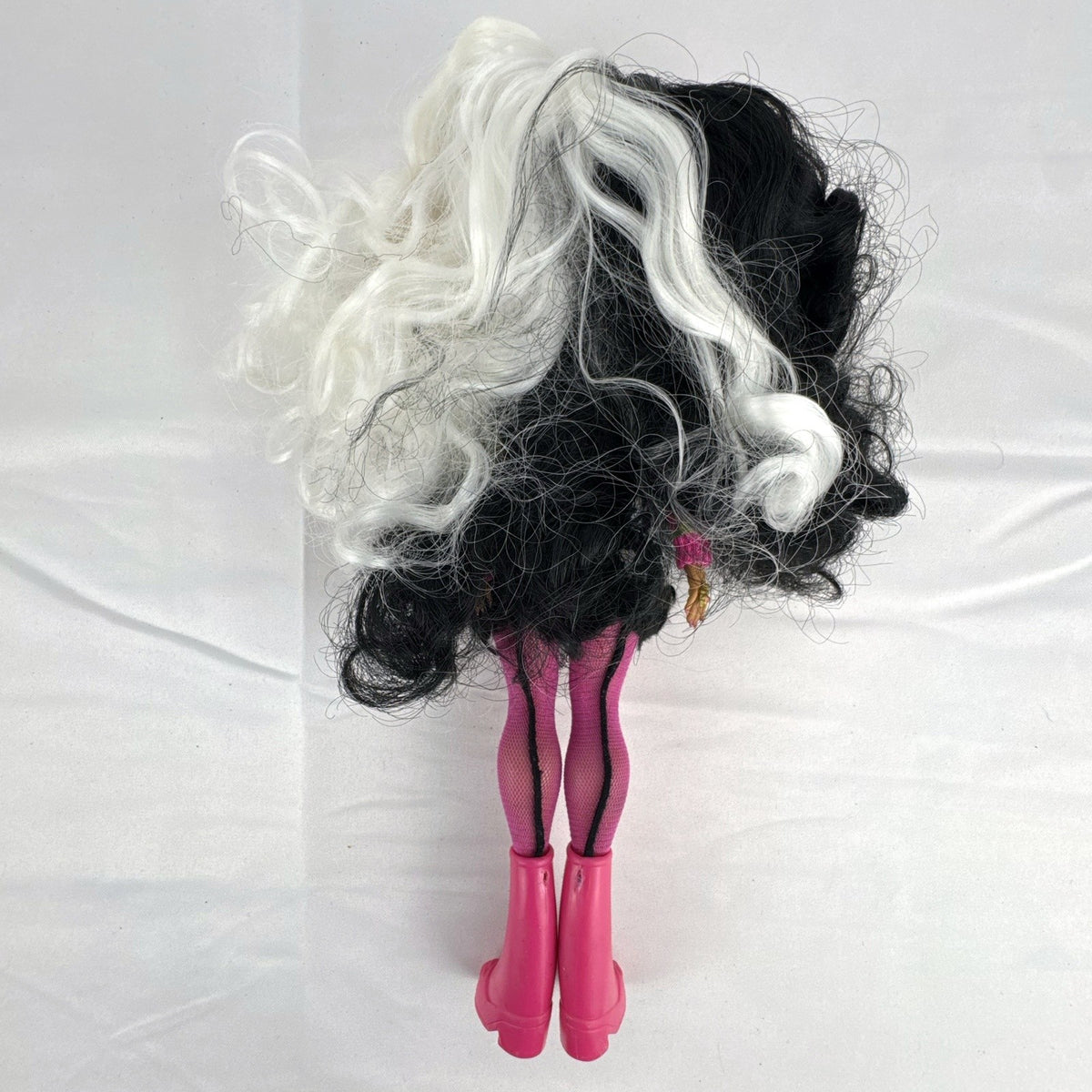 MGA L.O.L. Surprise! O.M.G. 10-inch fashion doll with split black and white curly hair in houndstooth outfit