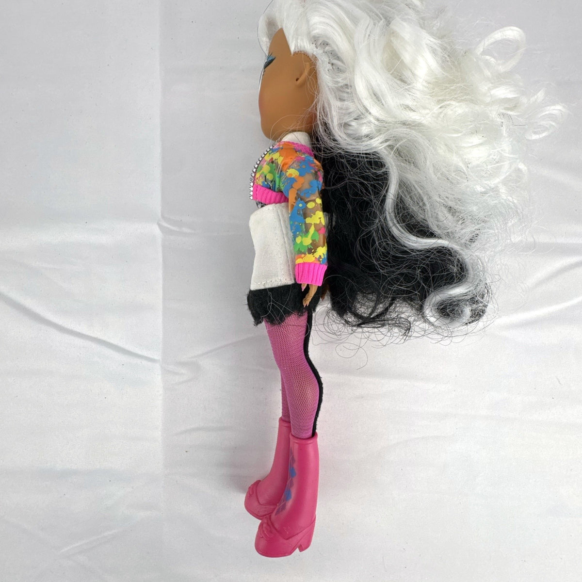 MGA L.O.L. Surprise! O.M.G. 10-inch fashion doll with split black and white curly hair in houndstooth outfit