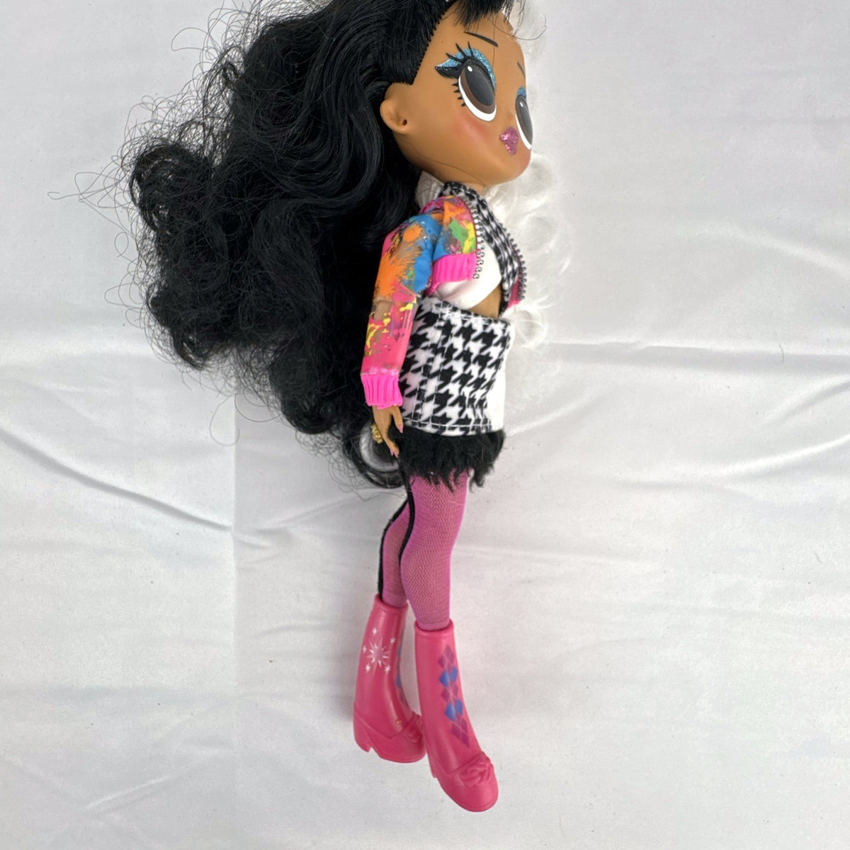 MGA L.O.L. Surprise! O.M.G. 10-inch fashion doll with split black and white curly hair in houndstooth outfit