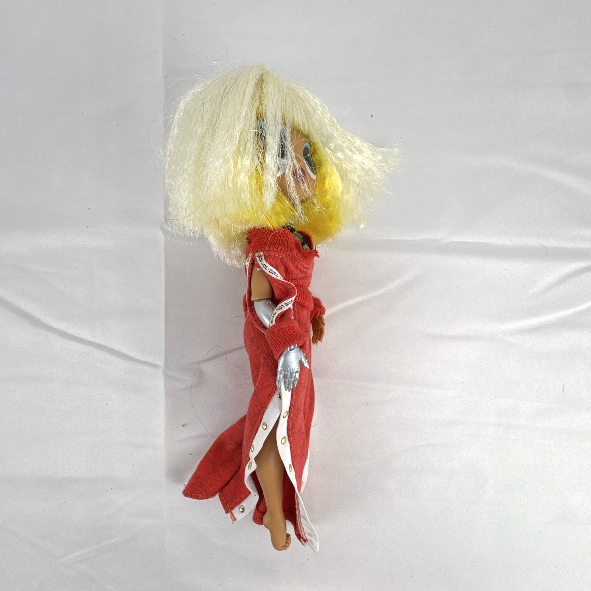 MGA L.O.L. Surprise! O.M.G. Lights Speedster 10-inch fashion doll wearing red tracksuit with blonde and neon yellow hair