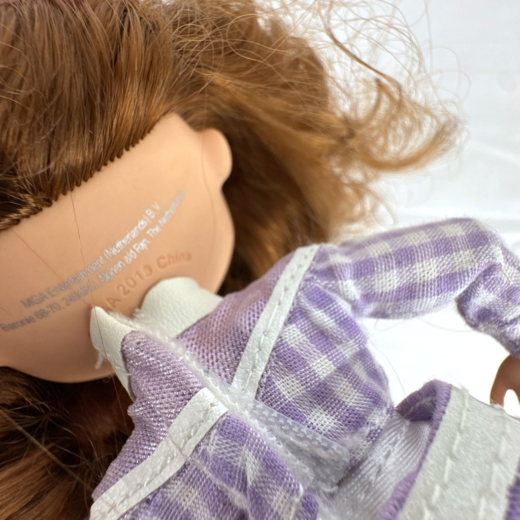 MGA L.O.L. Surprise! O.M.G. Remix Lonestar fashion doll wearing a purple western cowgirl outfit