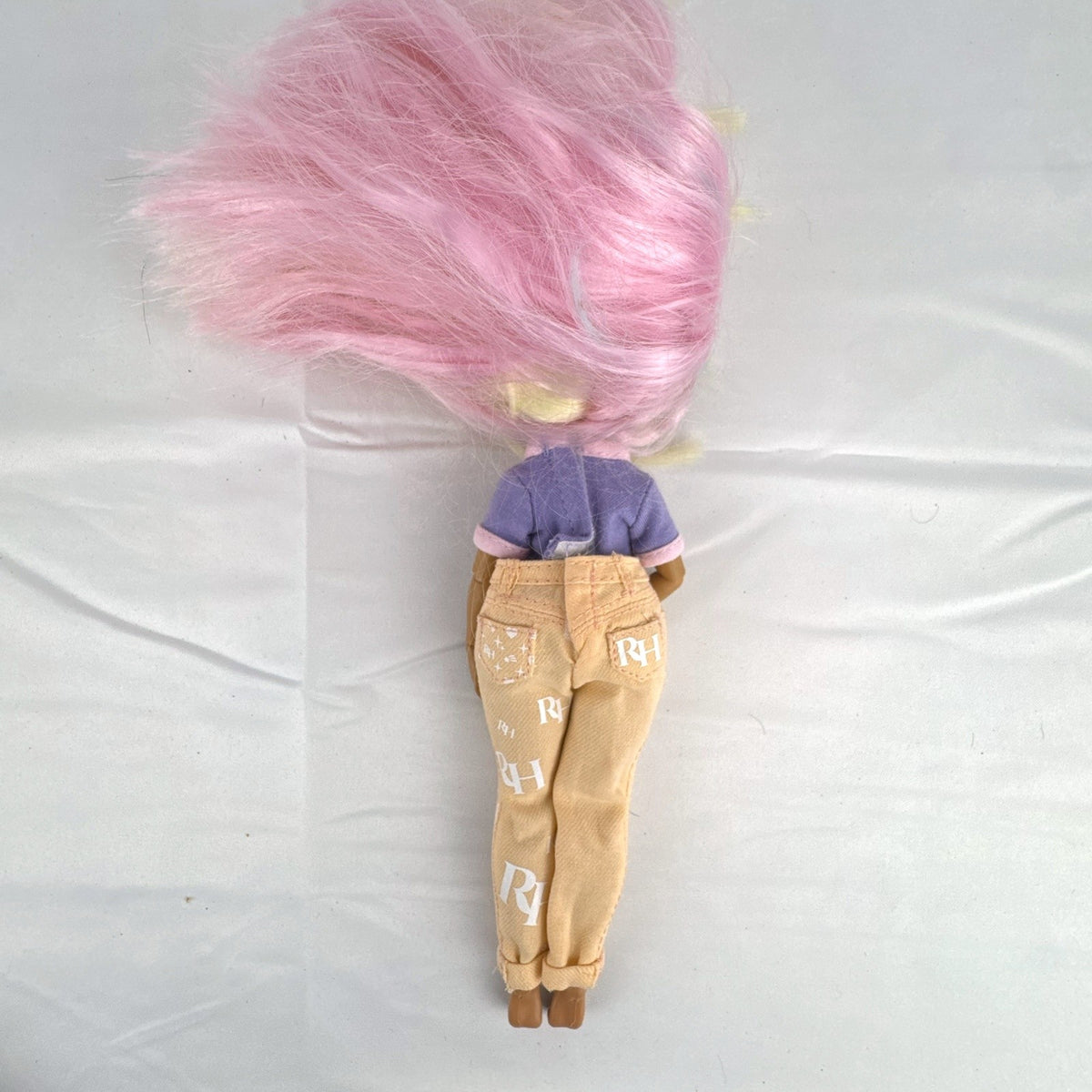 MGA Entertainment LOL Surprise OMG Candylicious fashion doll in mixed outfit with pastel hair