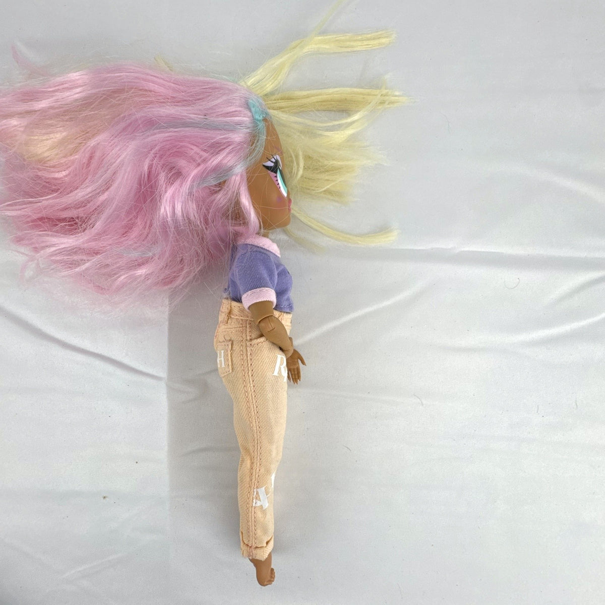 MGA Entertainment LOL Surprise OMG Candylicious fashion doll in mixed outfit with pastel hair