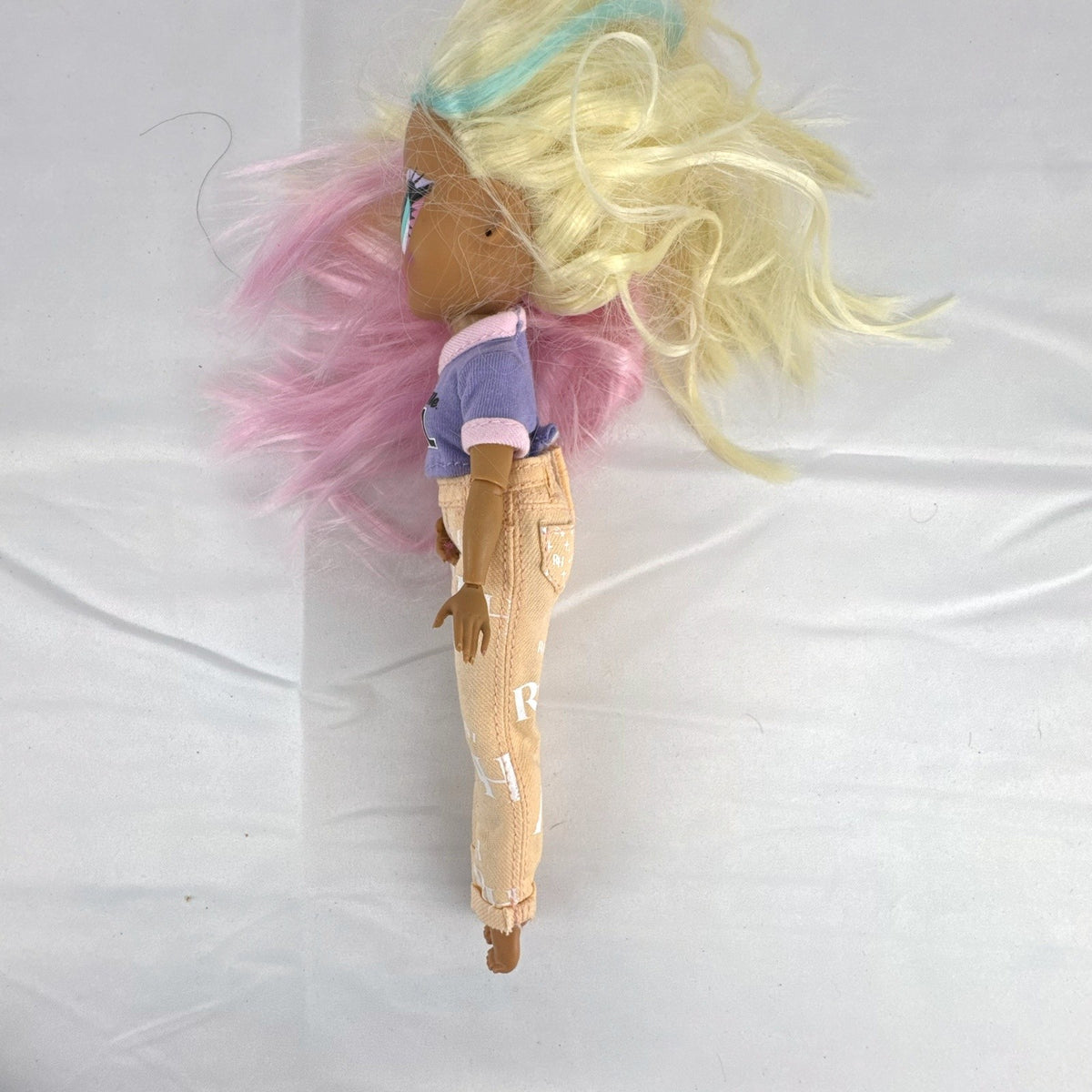 MGA Entertainment LOL Surprise OMG Candylicious fashion doll in mixed outfit with pastel hair