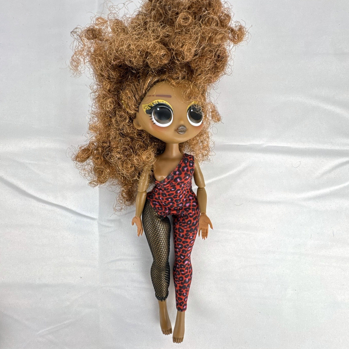 MGA LOL Surprise OMG Remix Ferocious 10-inch fashion doll wearing red leopard print bodysuit with tinsel curly hair