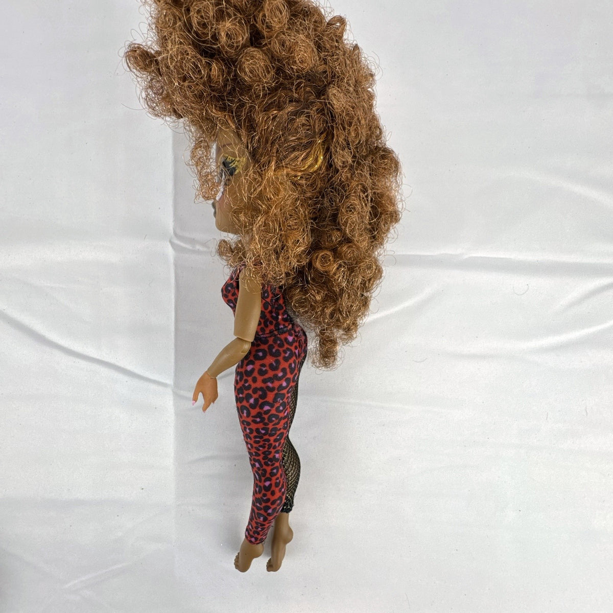 MGA LOL Surprise OMG Remix Ferocious 10-inch fashion doll wearing red leopard print bodysuit with tinsel curly hair