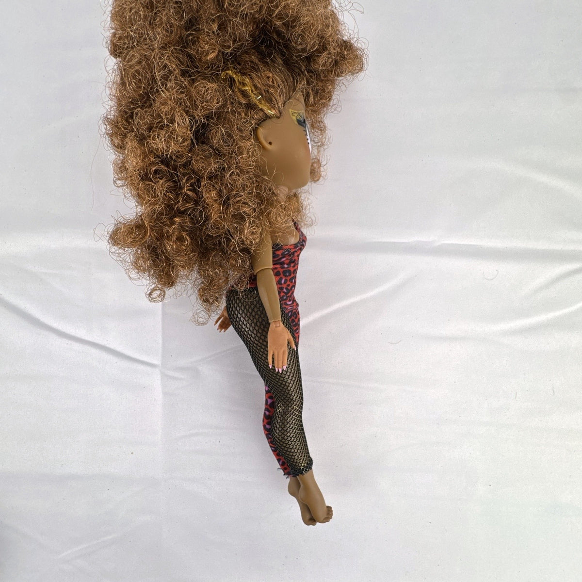 MGA LOL Surprise OMG Remix Ferocious 10-inch fashion doll wearing red leopard print bodysuit with tinsel curly hair