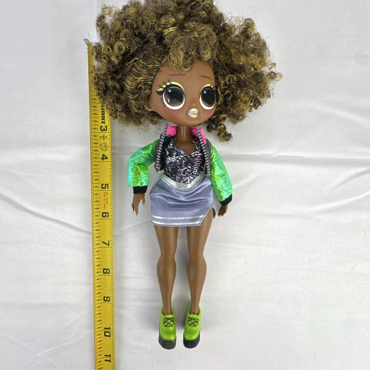 MGA Entertainment LOL Surprise OMG Royal Bee 10-inch doll in metallic outfit with lime green platform shoes