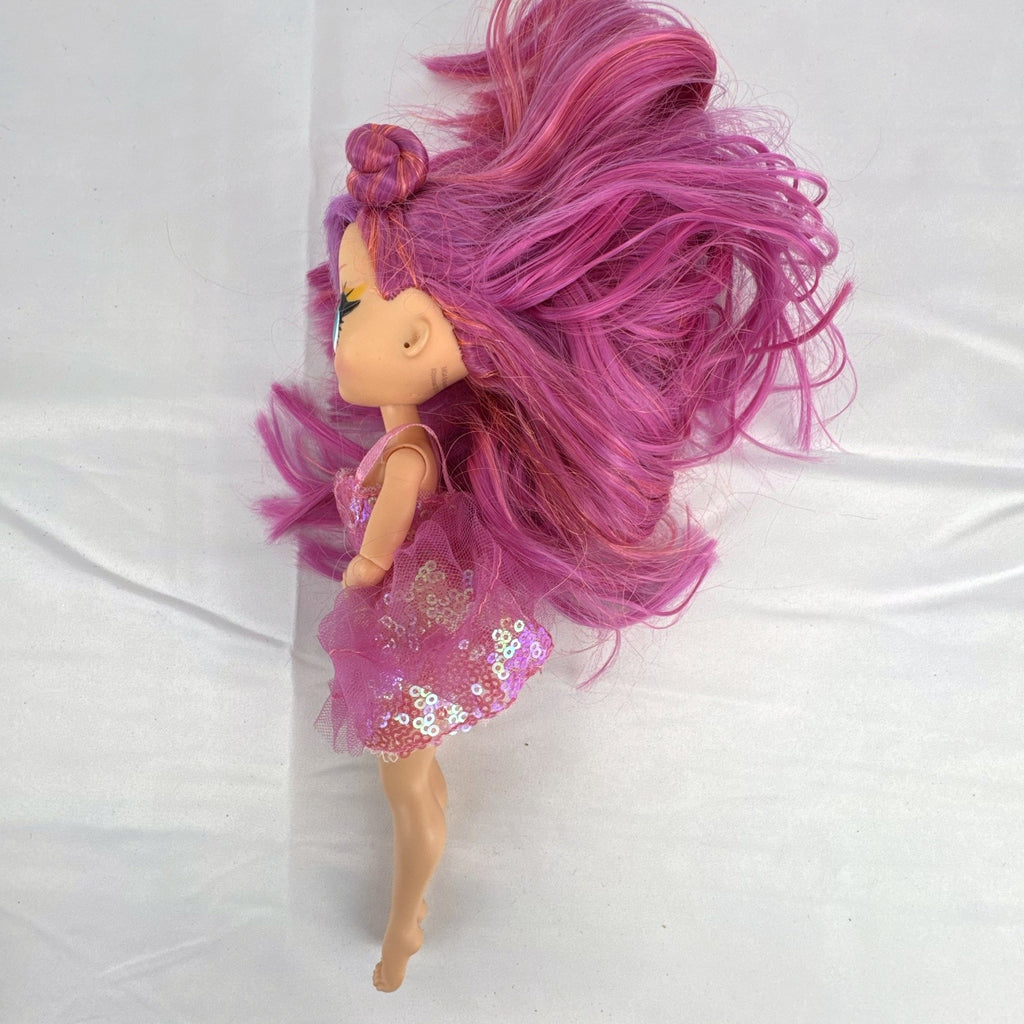MGA Entertainment L.O.L. Surprise O.M.G. Lights Dazzle 10-inch fashion doll with pink hair in a sparkly sequin dress.