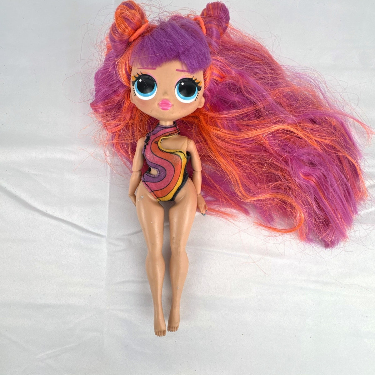 MGA L.O.L. Surprise! OMG Roller Chick fashion doll with straight pink hair and blue eyes