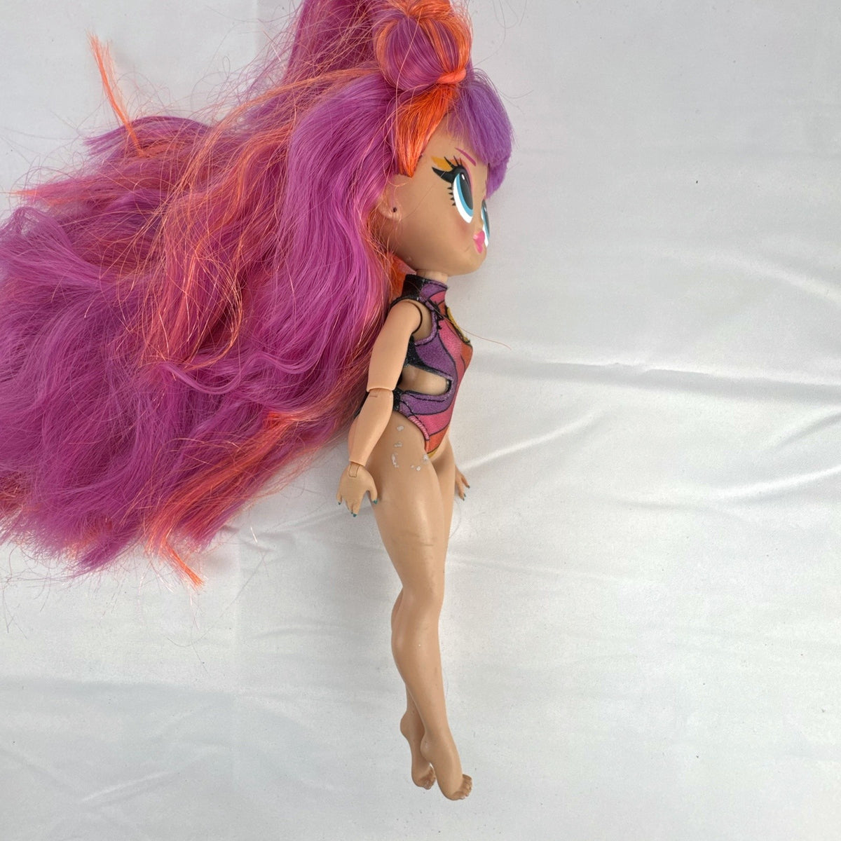 MGA L.O.L. Surprise! OMG Roller Chick fashion doll with straight pink hair and blue eyes