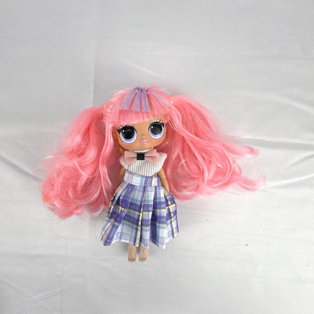 MGA L.O.L. Surprise O.M.G. Tweens Fancy Gurl fashion doll in purple plaid skirt with pink pigtails