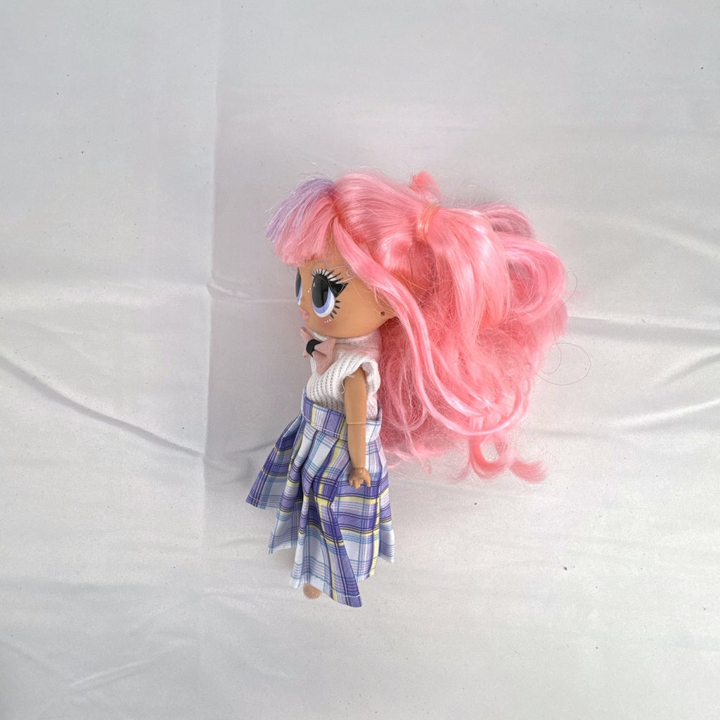 MGA L.O.L. Surprise O.M.G. Tweens Fancy Gurl fashion doll in purple plaid skirt with pink pigtails