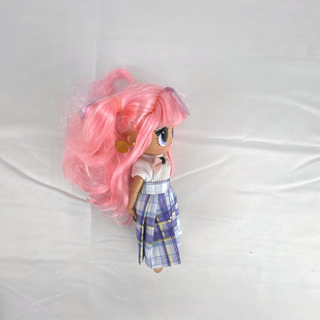 MGA L.O.L. Surprise O.M.G. Tweens Fancy Gurl fashion doll in purple plaid skirt with pink pigtails