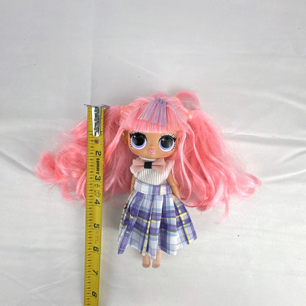 MGA L.O.L. Surprise O.M.G. Tweens Fancy Gurl fashion doll in purple plaid skirt with pink pigtails