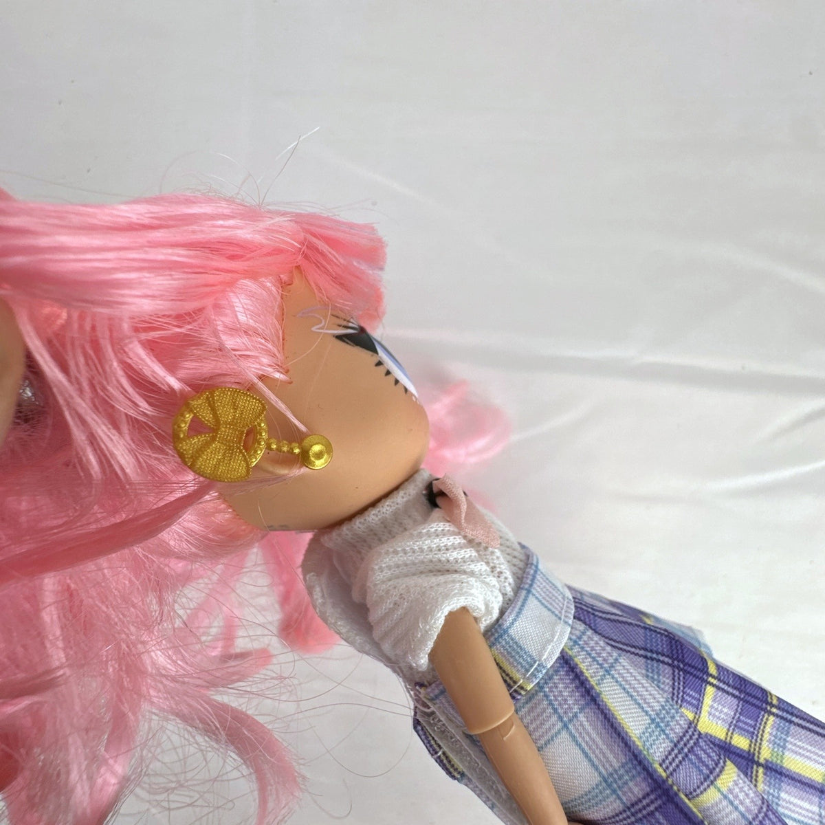 MGA L.O.L. Surprise O.M.G. Tweens Fancy Gurl fashion doll in purple plaid skirt with pink pigtails