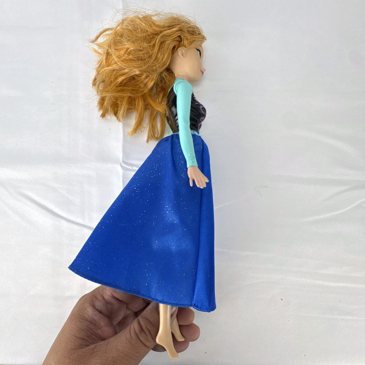 Hasbro Disney Frozen Royal Shimmer Anna 11-inch fashion doll with molded bodice and blue glitter skirt