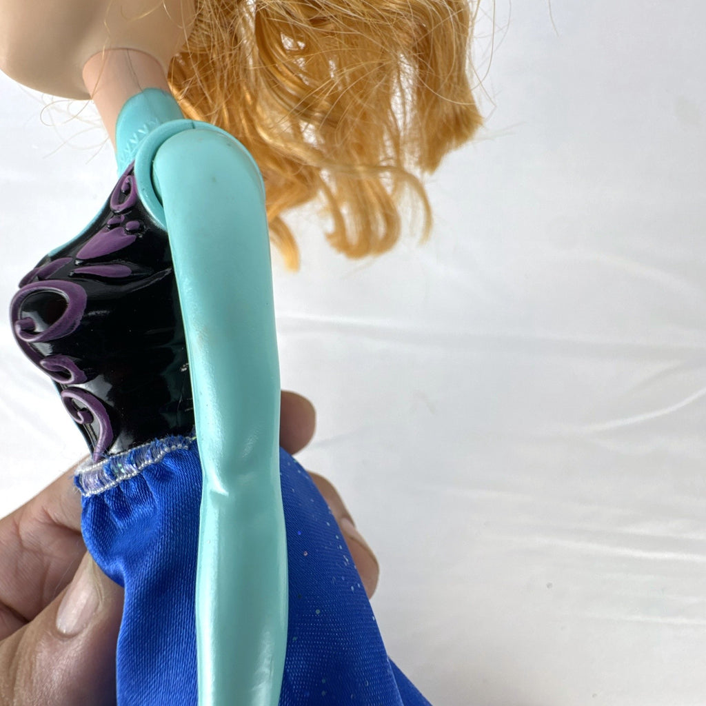 Hasbro Disney Frozen Royal Shimmer Anna 11-inch fashion doll with molded bodice and blue glitter skirt