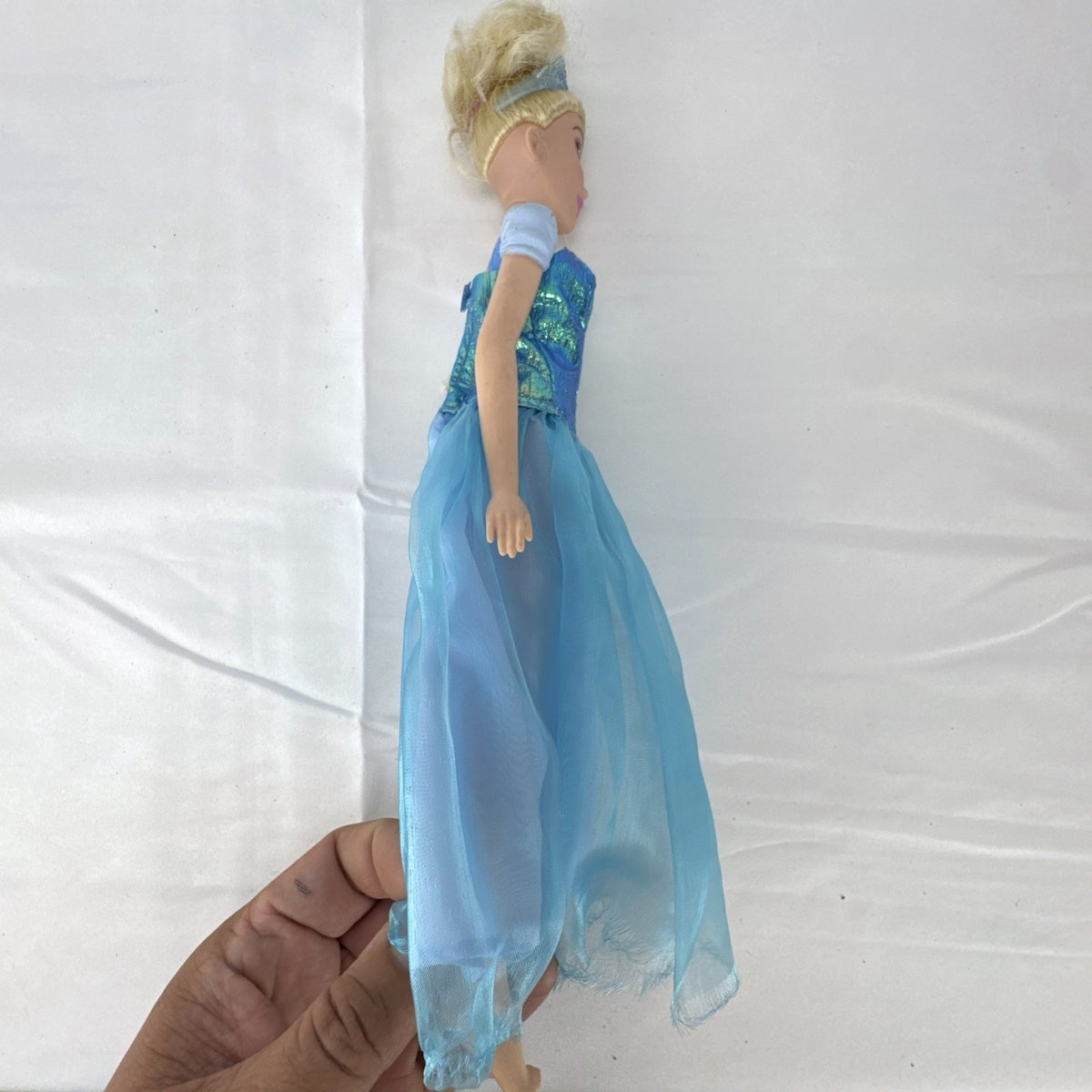 Disney Princess Cinderella 12-inch fashion doll wearing an iridescent blue ball gown and matching tiara