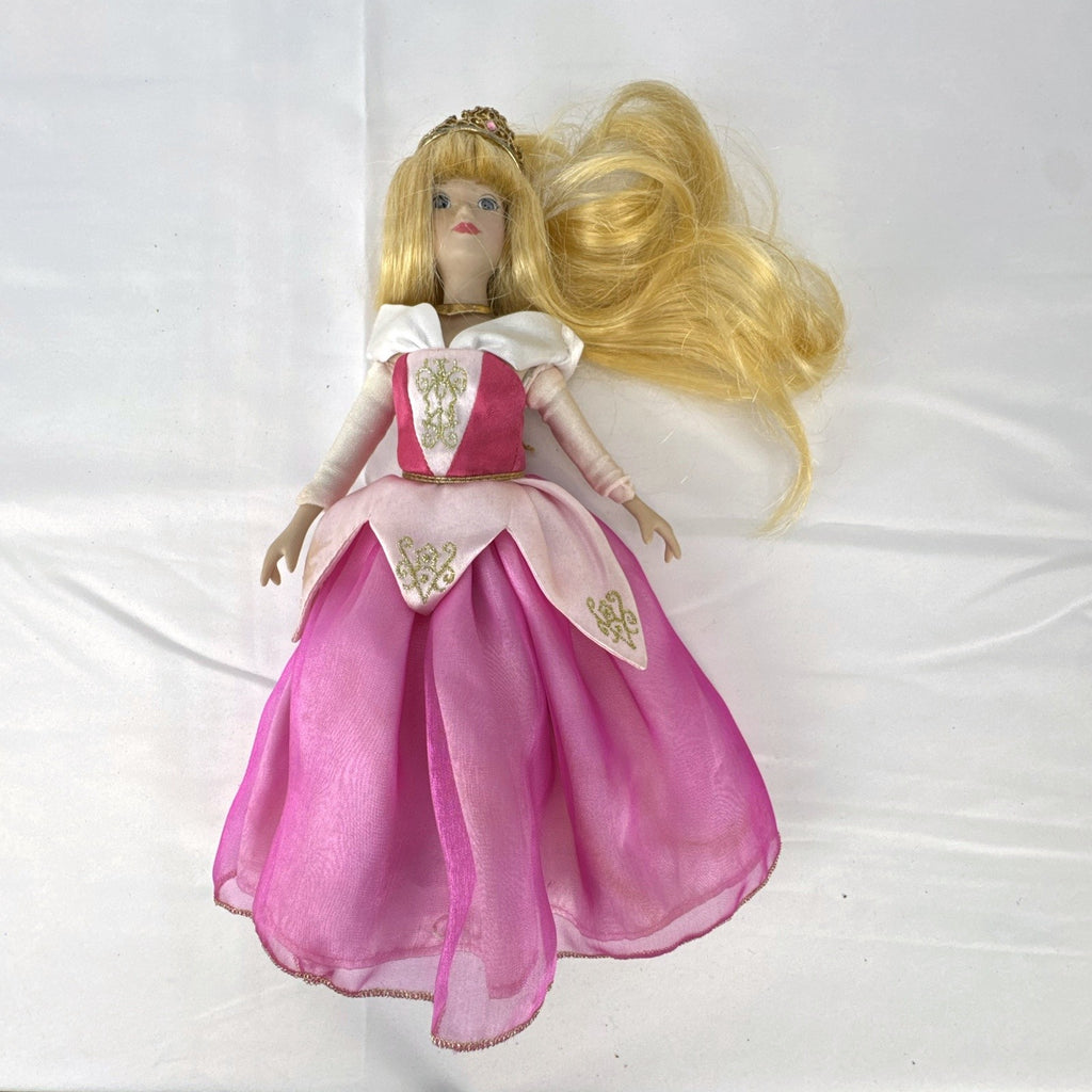 The Brass Key Disney Princess Aurora 12-inch porcelain doll wearing a pink ballgown and golden tiara
