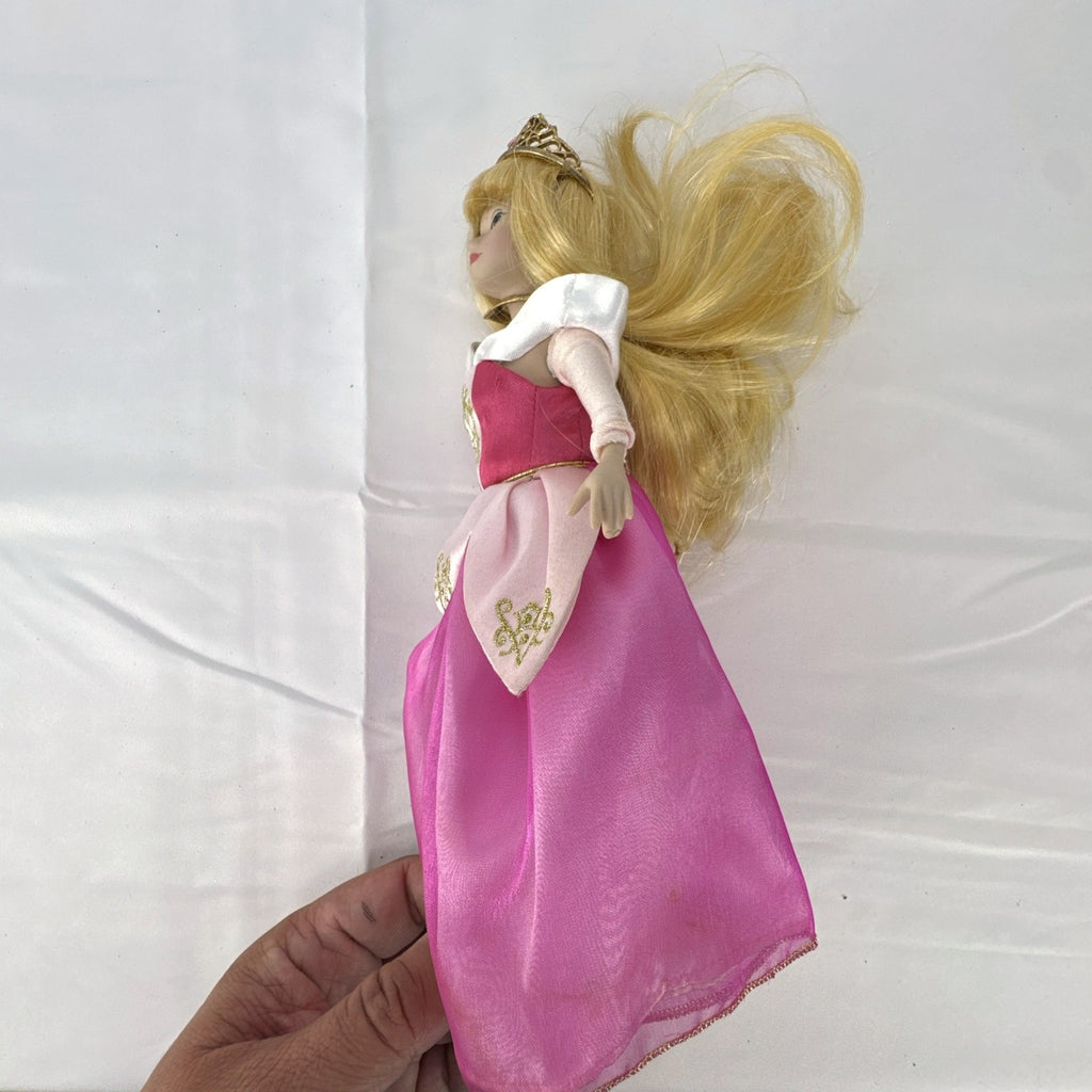 The Brass Key Disney Princess Aurora 12-inch porcelain doll wearing a pink ballgown and golden tiara