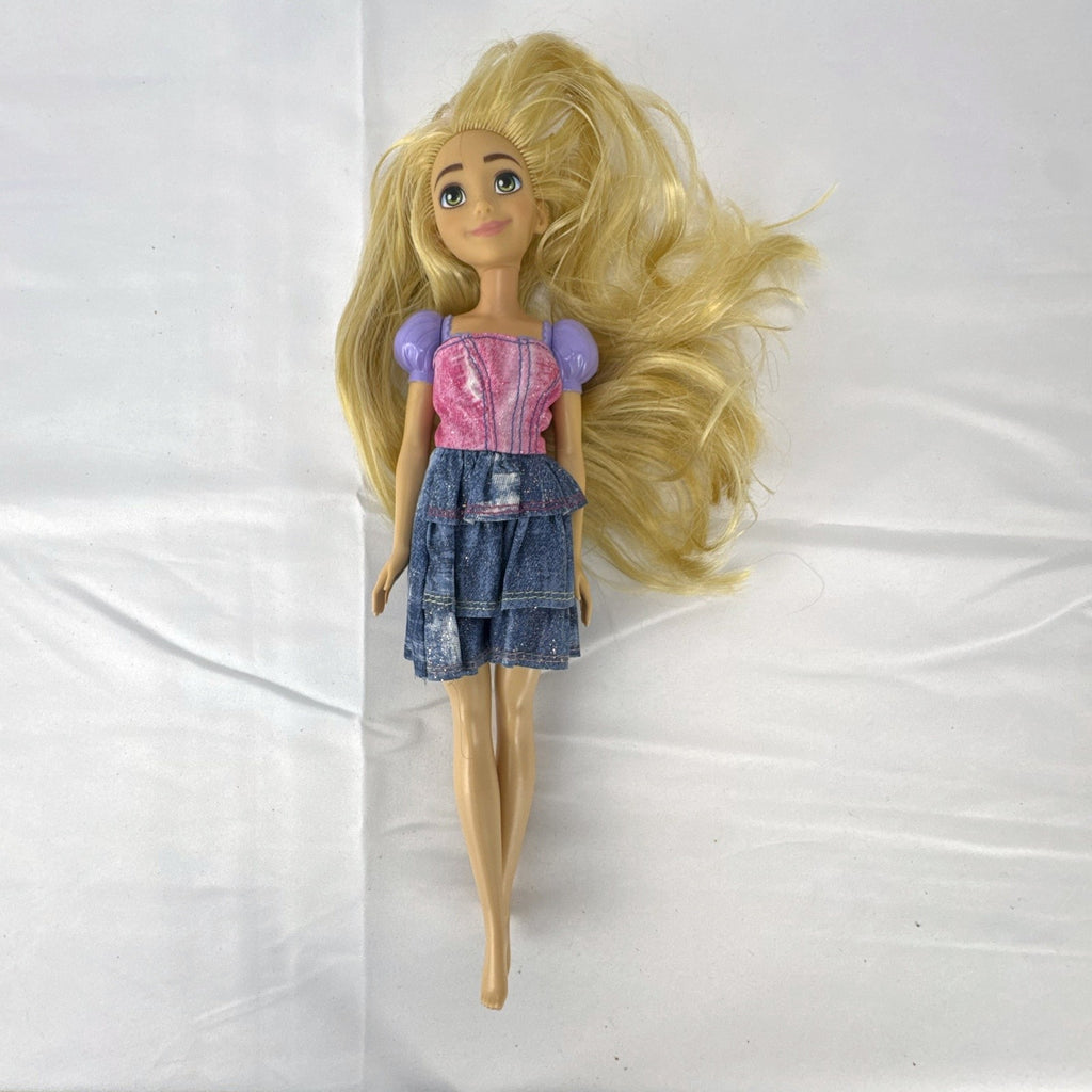 Mattel Disney Princess Rapunzel 11-inch fashion doll with long blonde hair and tiered skirt.