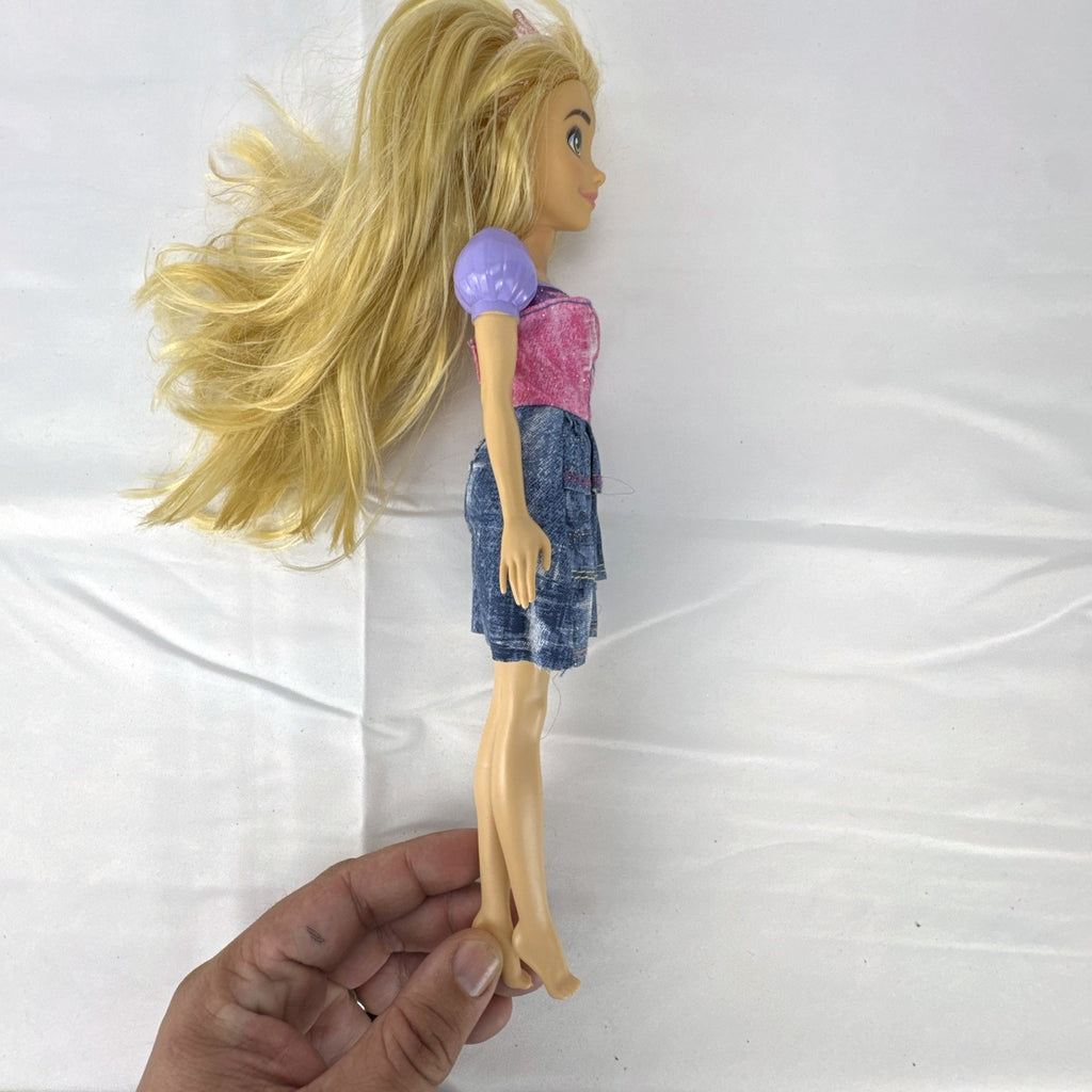 Mattel Disney Princess Rapunzel 11-inch fashion doll with long blonde hair and tiered skirt.