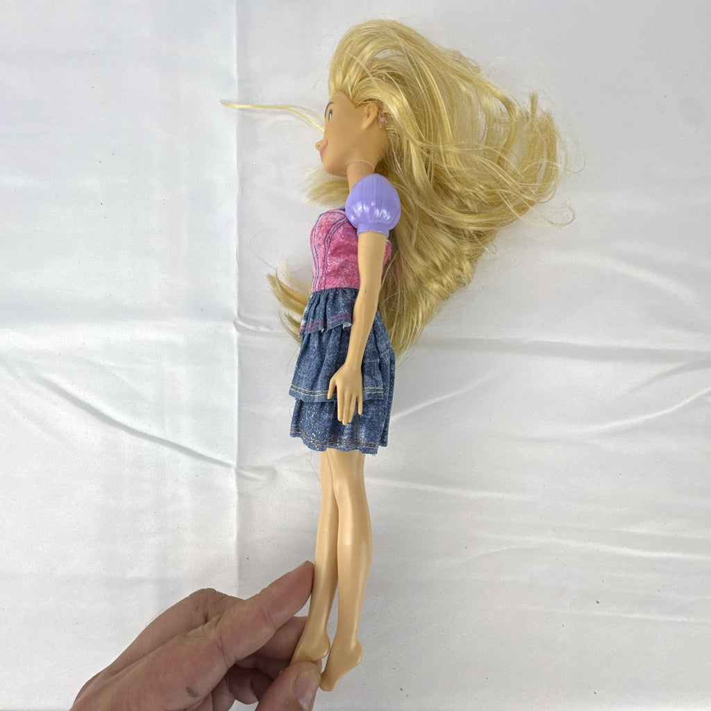 Mattel Disney Princess Rapunzel 11-inch fashion doll with long blonde hair and tiered skirt.